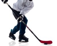 взятка хоккейными клюшками